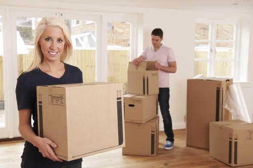 Moving team planning house removals in Wimbledon on a residential street