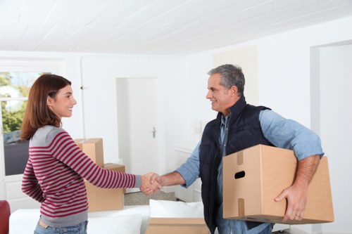 Packed moving boxes and furniture ready for house removals in Wimbledon