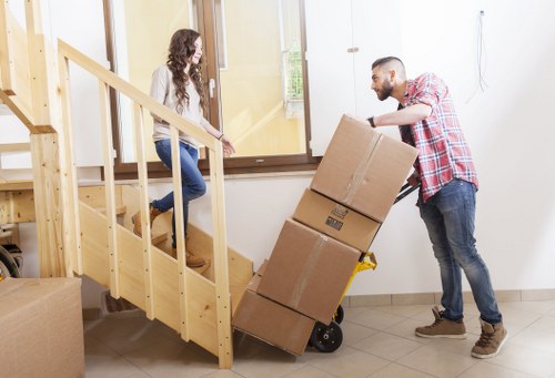 Furniture being carefully moved from a Wimbledon property