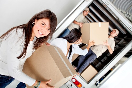 Local moving truck helping with furniture loading in Wimbledon